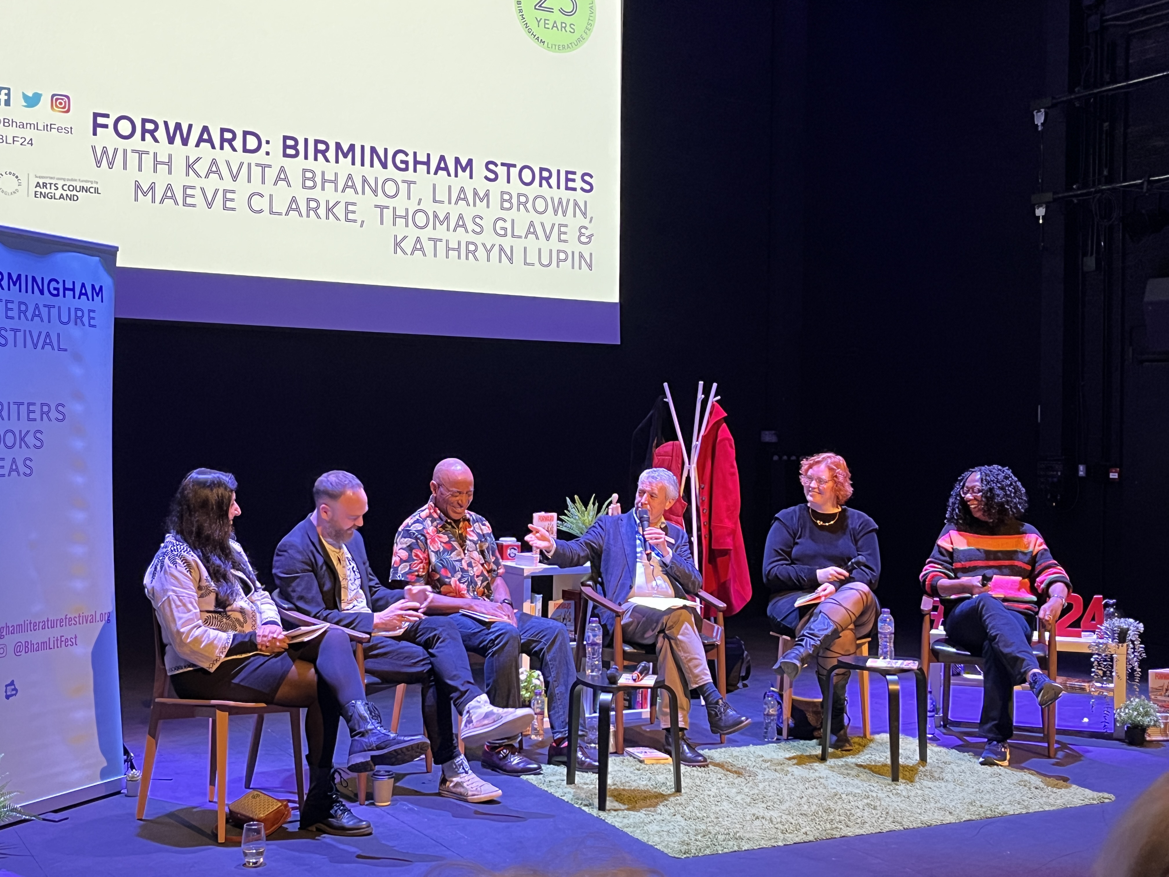 five white, black and poc writers from the west midlands sit on a stage and discuss their work